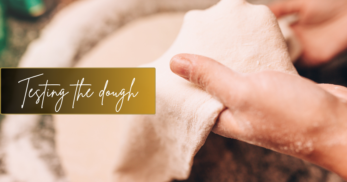 hands stretching the dough