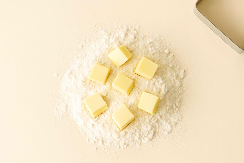cold butter cubes of cold butter on a mound of flour