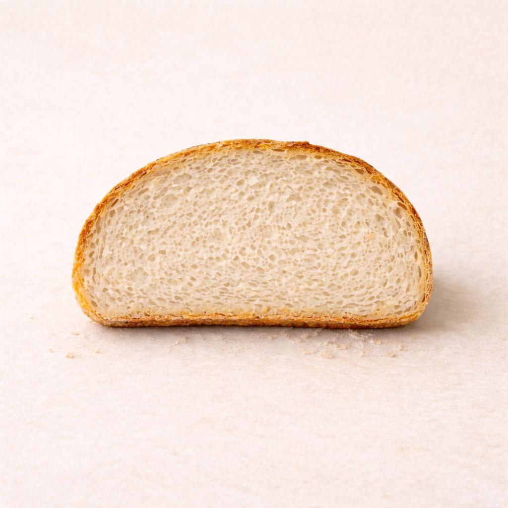 Dense bread tight crumb with very small uniform holes and compact sponge-like interior